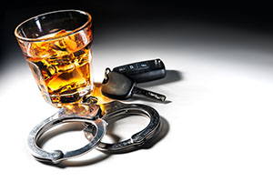 Glass of liquor and car keys